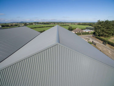 Aerial view of commercial building showing ridge capping on corrugated roof, Ireland