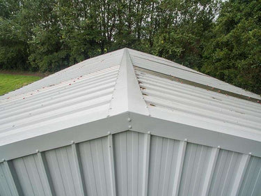 Galvanised barge flashing and ridge capping with foam fillers on corrugated roof, Waterford Ireland